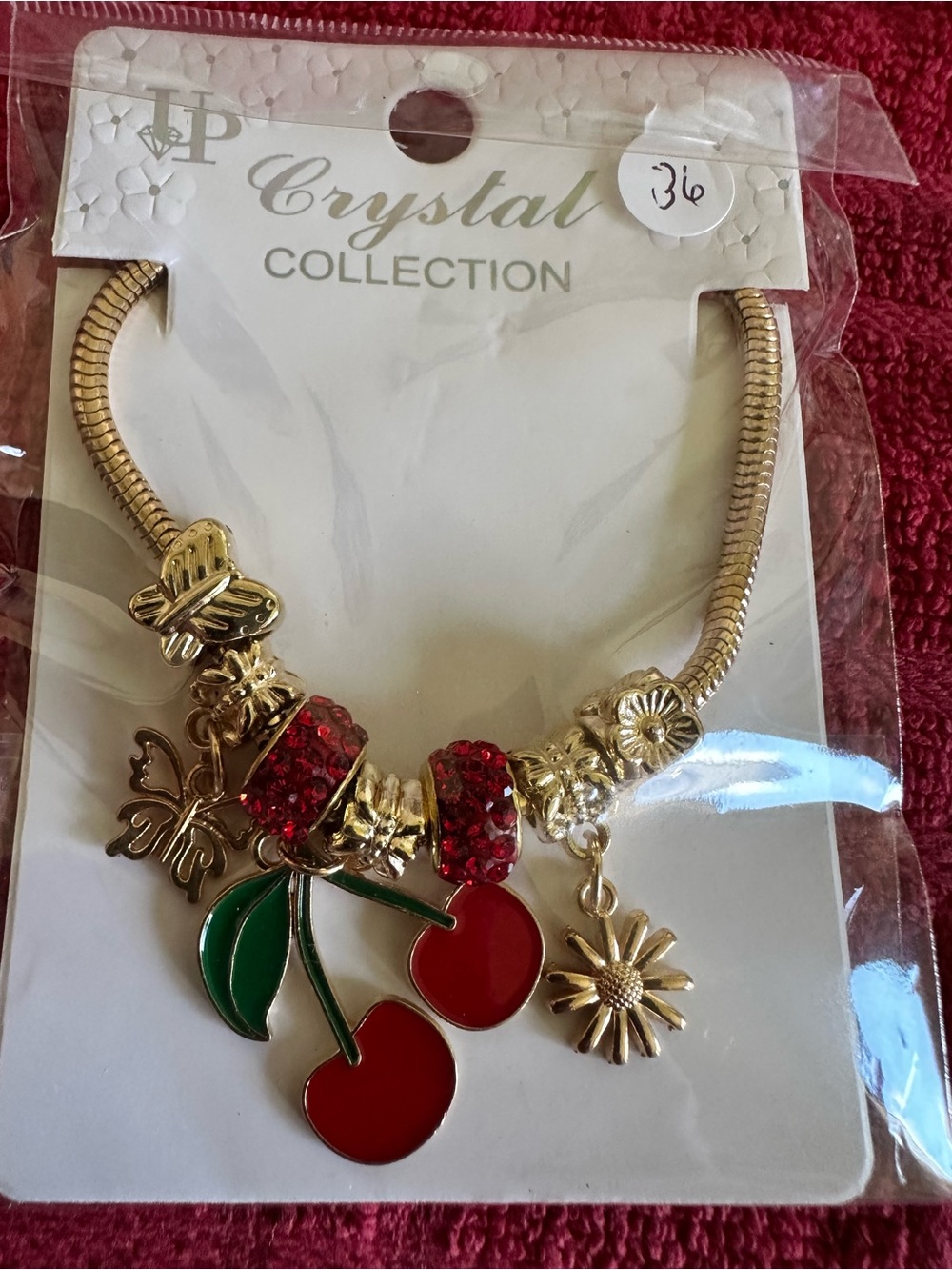 Gold-Tone Cherry Charm Bracelet with Red Enamel & Green Leaves